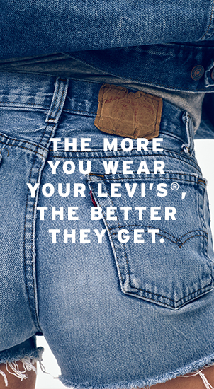 Image Description: The image background is the back of someone wearing Levi's denim shorts. It features the classic back patch, Levi's red tab and arcuate stitch. There is white text that reads: 'The more you wear your Levi's, the better they get.'